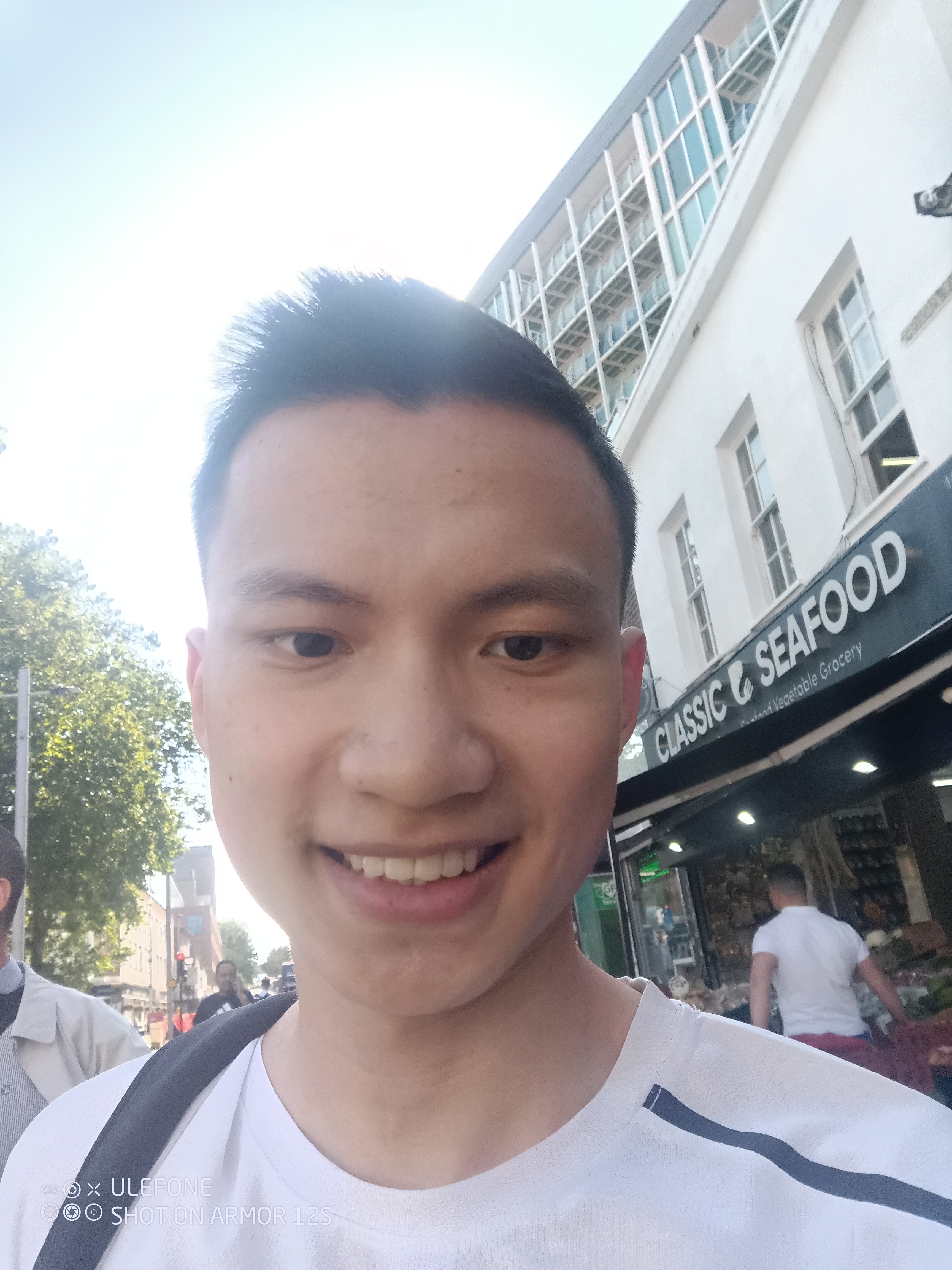 Contemporary salon interior with an experienced nail tech demonstrating a sculpted set to a client