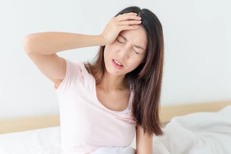 Women suffering from migraine headache 