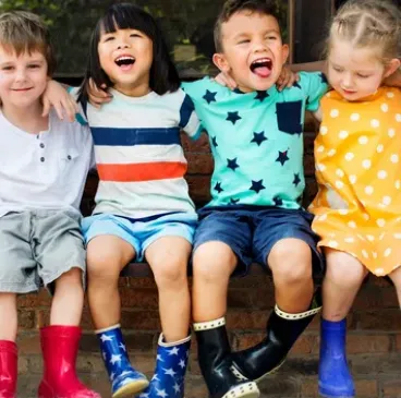 Children learning and playing in a bright childcare classroom