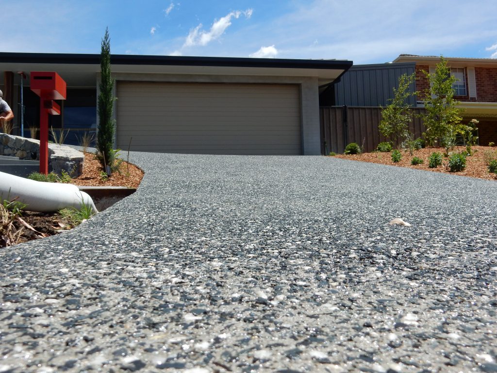 a dining room table with a bowl of fruit on it