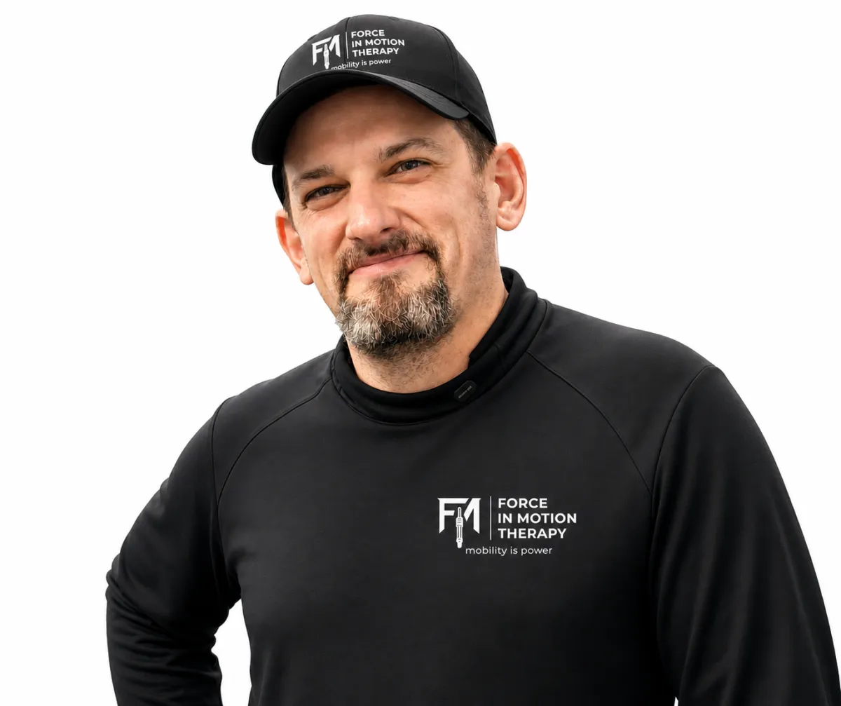 Dr. Matt D’Elia, physical therapist, standing in his modern clinic environment in Warwick, Rhode Island