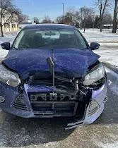 woman placing sticky notes on wall