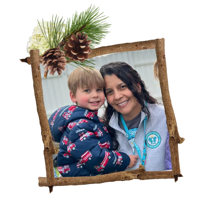 Childcare staff with preschool child