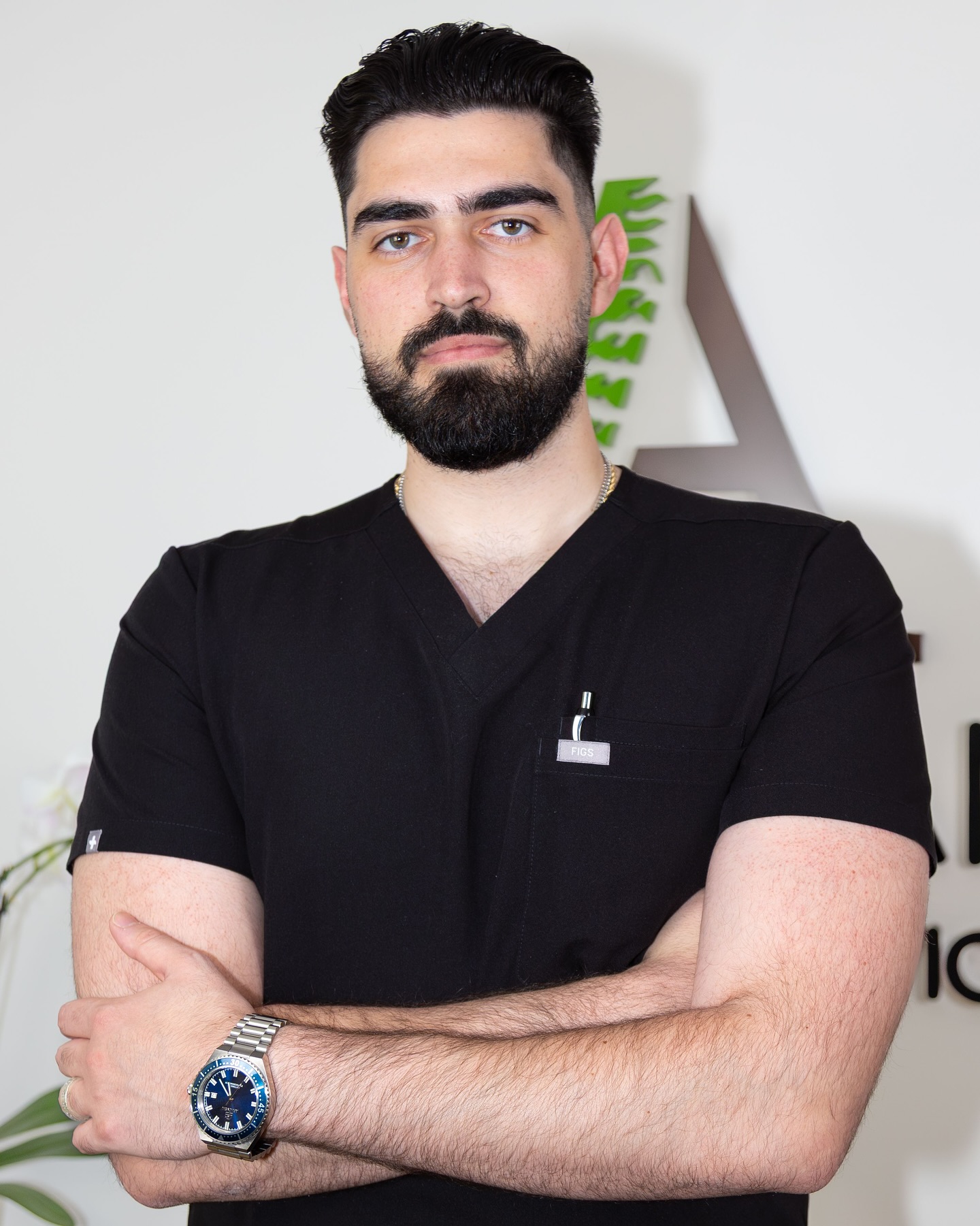 Sports chiropractor working with an athlete in a clinic setting