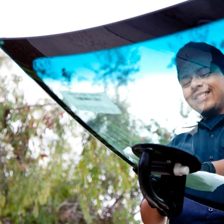 Windshield being installed