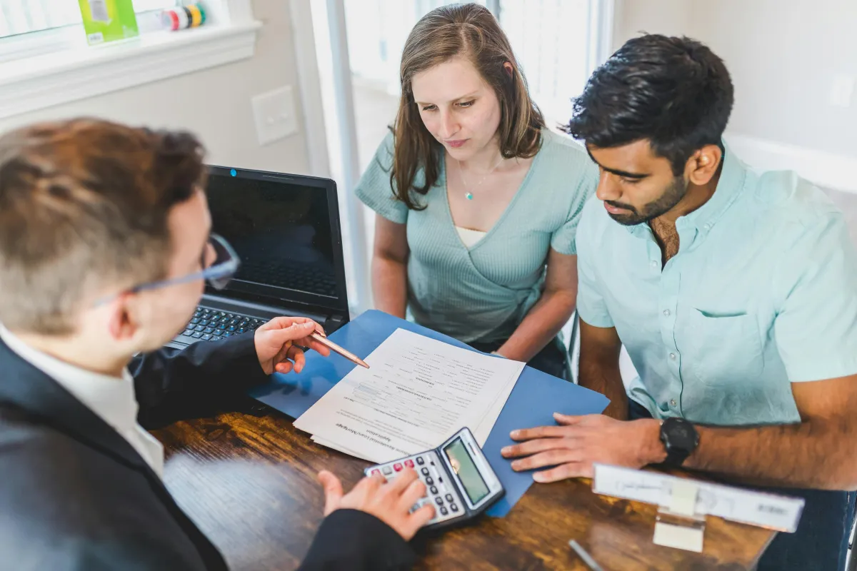 Couple meeting with financial advisor to discuss indexed universal life insurance options