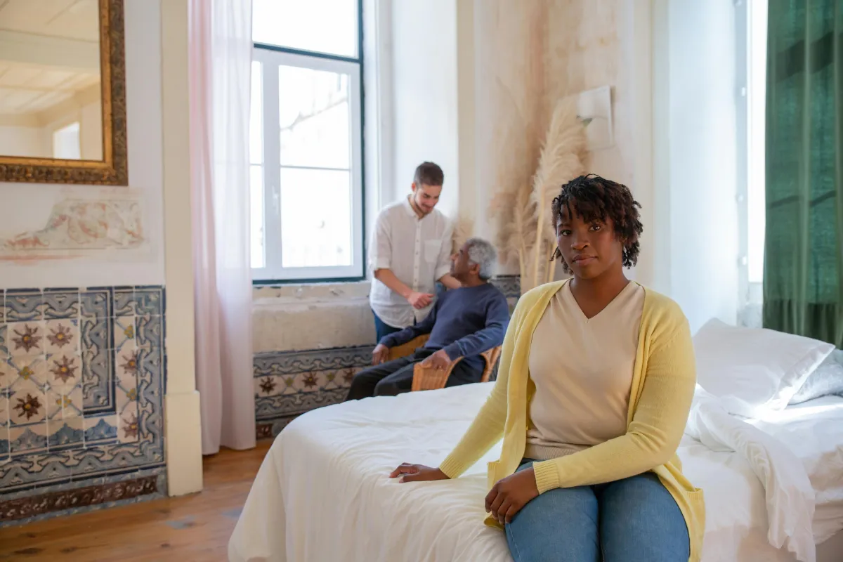 Senior man receiving in-home care from a nurse covered by long term care insurance