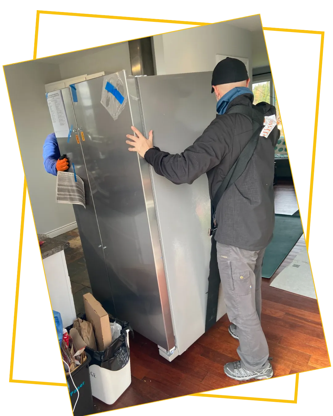 Heritage Movers professional carefully moving a refrigerator, providing expert appliance relocation and installation services across Nova Scotia and the Maritimes