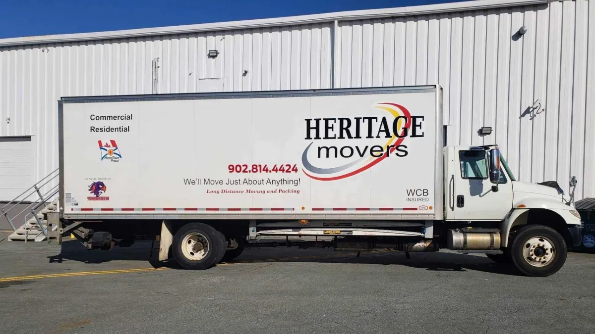 Heritage Movers truck on the road, representing the company’s commitment to honesty, integrity, and reliable moving services across Prince Edward Island and Atlantic Canada