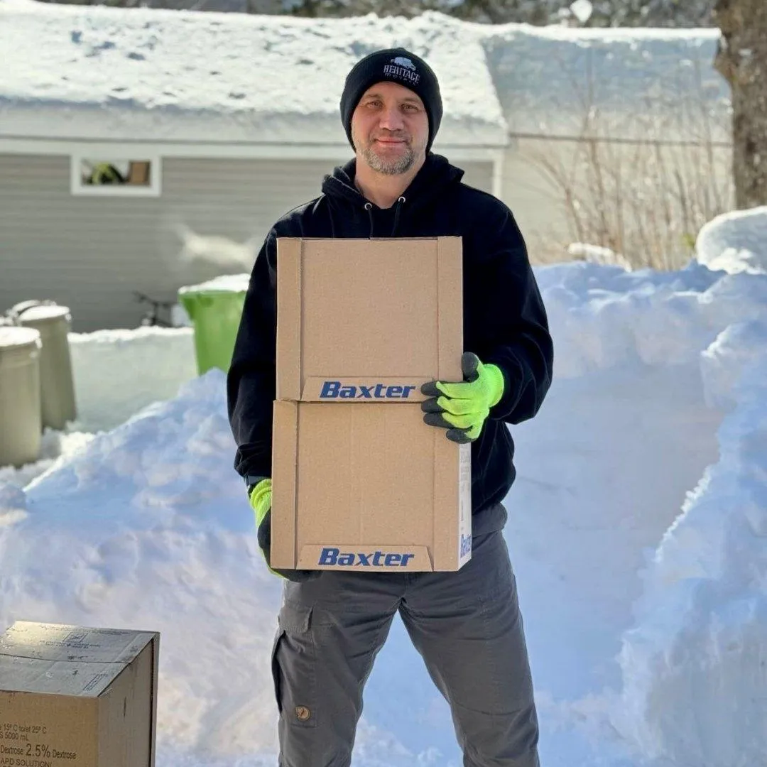 Heritage Movers team member carrying moving boxes, ready to assist with home and business moves in Nova Scotia, Prince Edward Island, New Brunswick and Newfoundland.