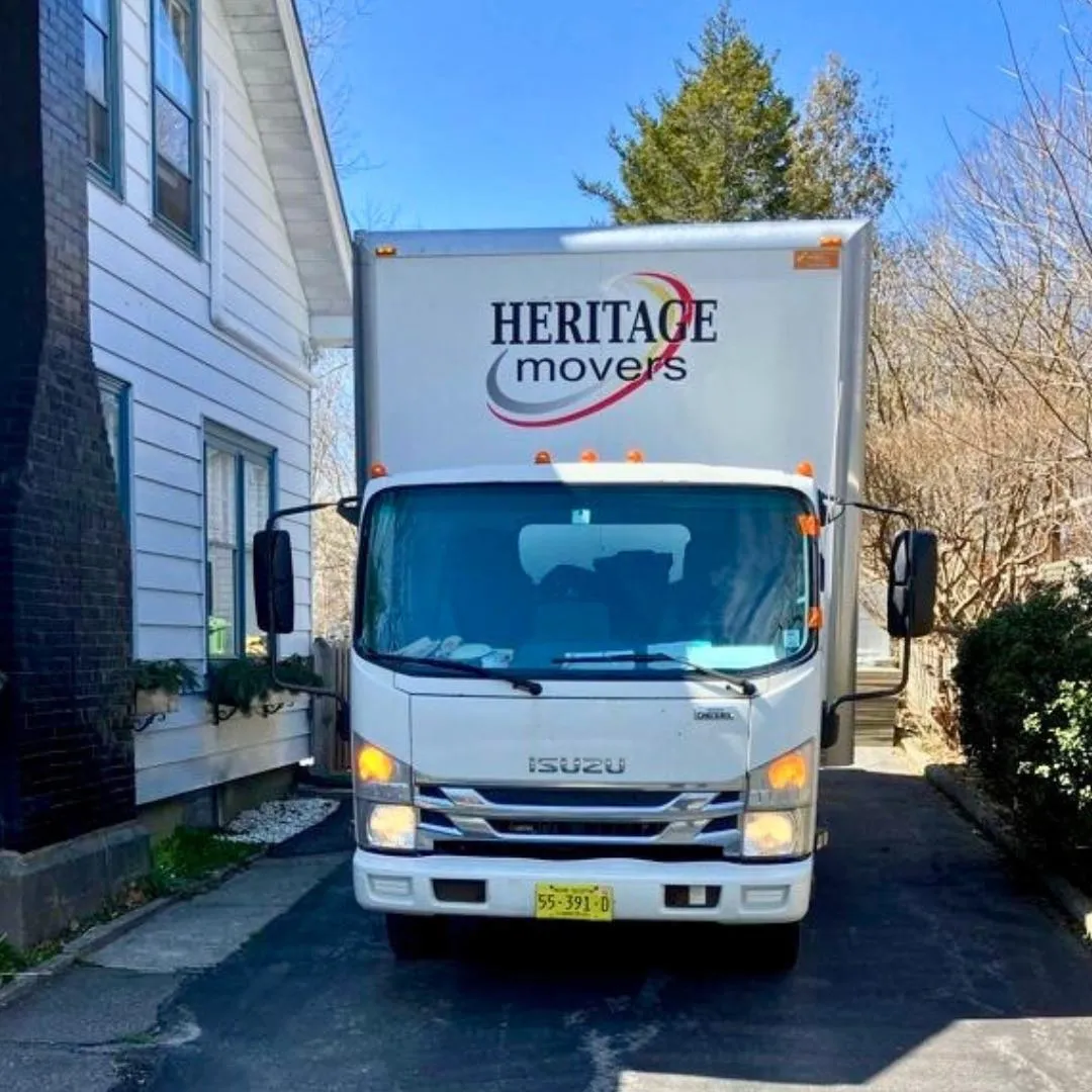 Heritage Movers truck parked outside a business, providing expert commercial moving services for offices and retail spaces across Halifax and Atlantic Canada.