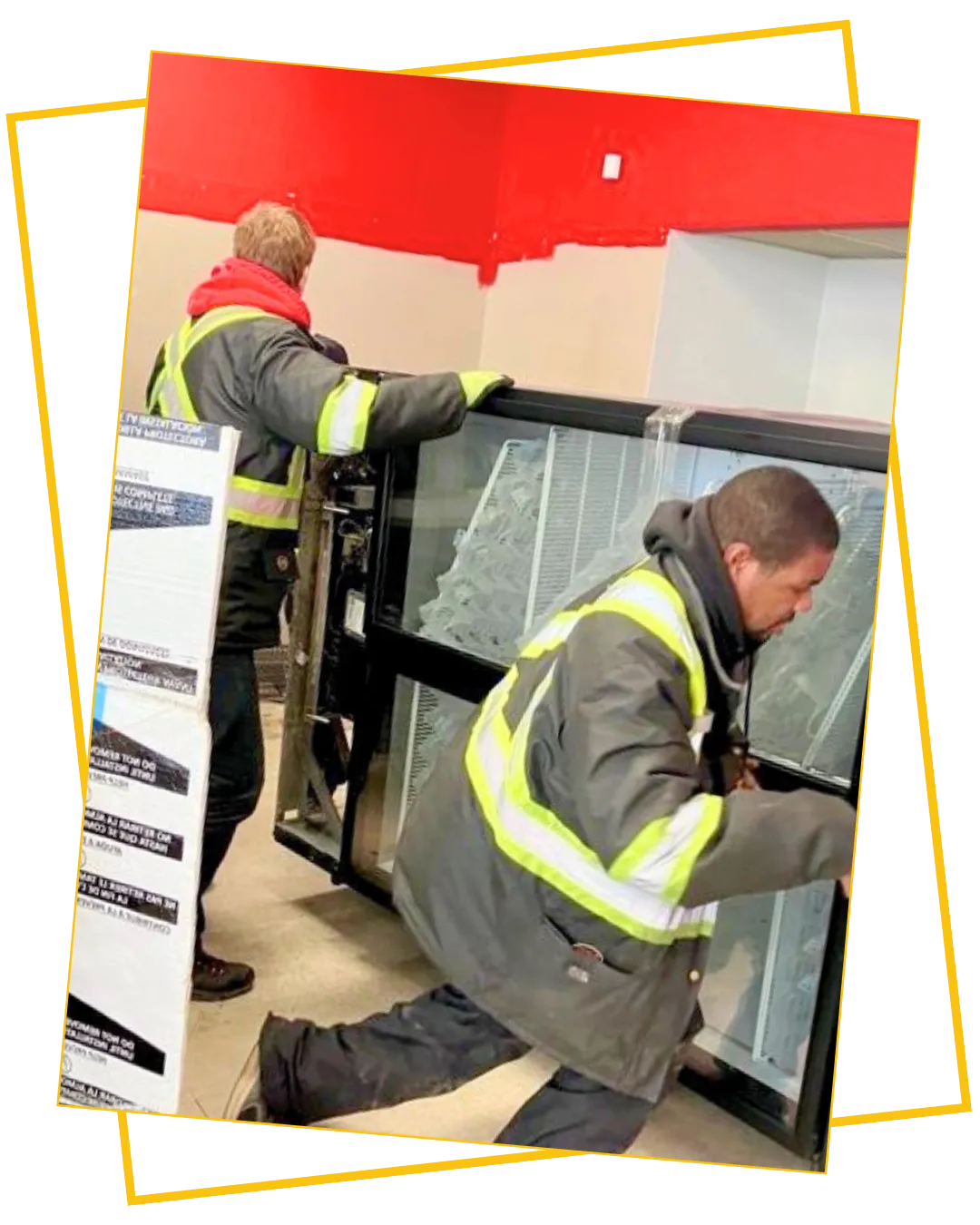 Heritage Movers team carefully transporting specialized business equipment, ensuring safe and secure delivery across New Brunswick and Atlantic Canada.