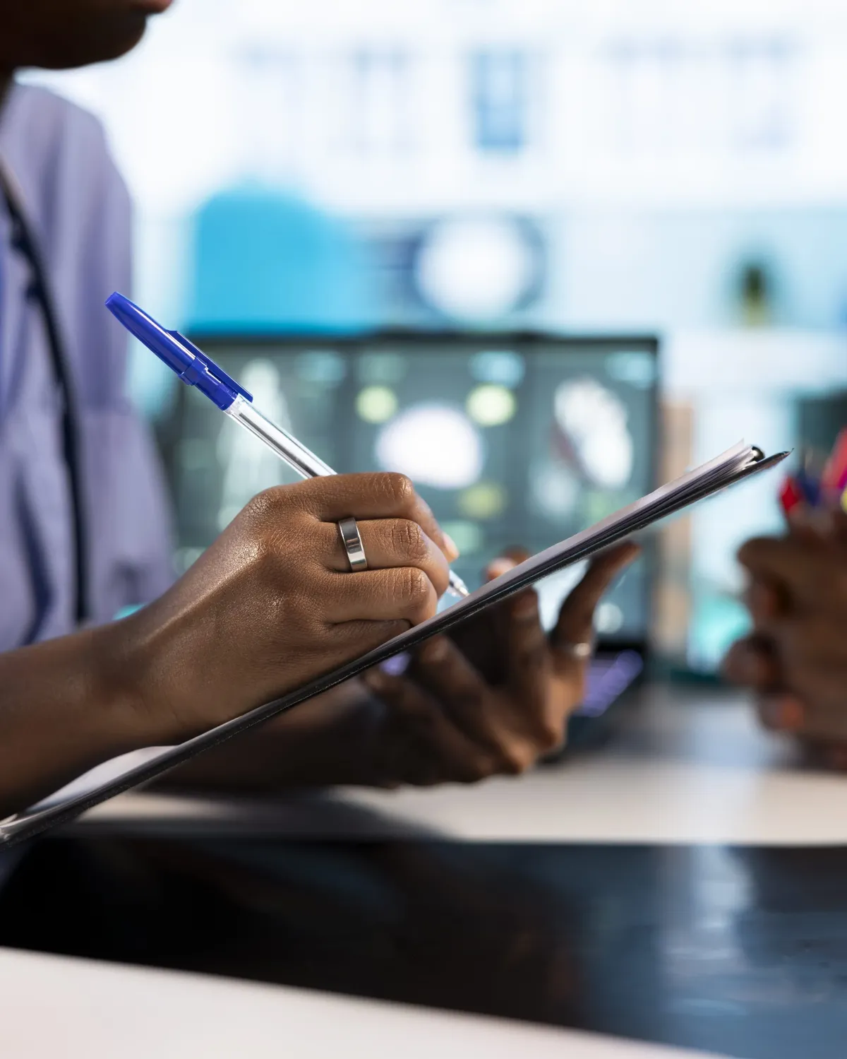 african american nurse takes notes consultation with obese patients
