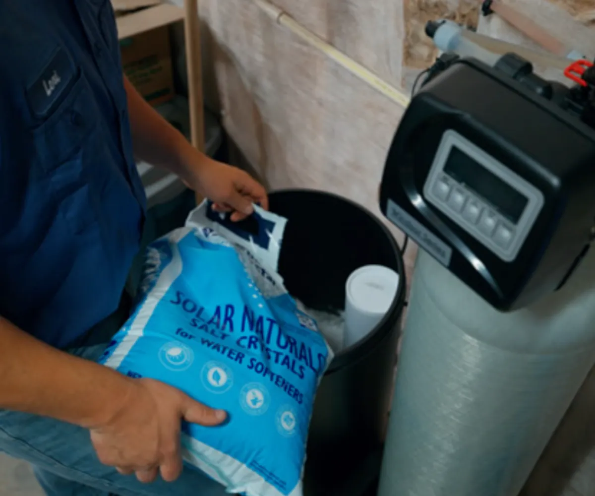 Stone retaining wall and driveway in front of a luxury home built by Mundo Landscaping in Tucson, AZ — expert hardscaping and curb appeal design.