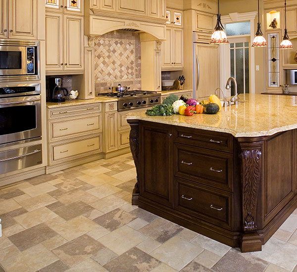 A clear plastic bottle with water on a tiled floor.