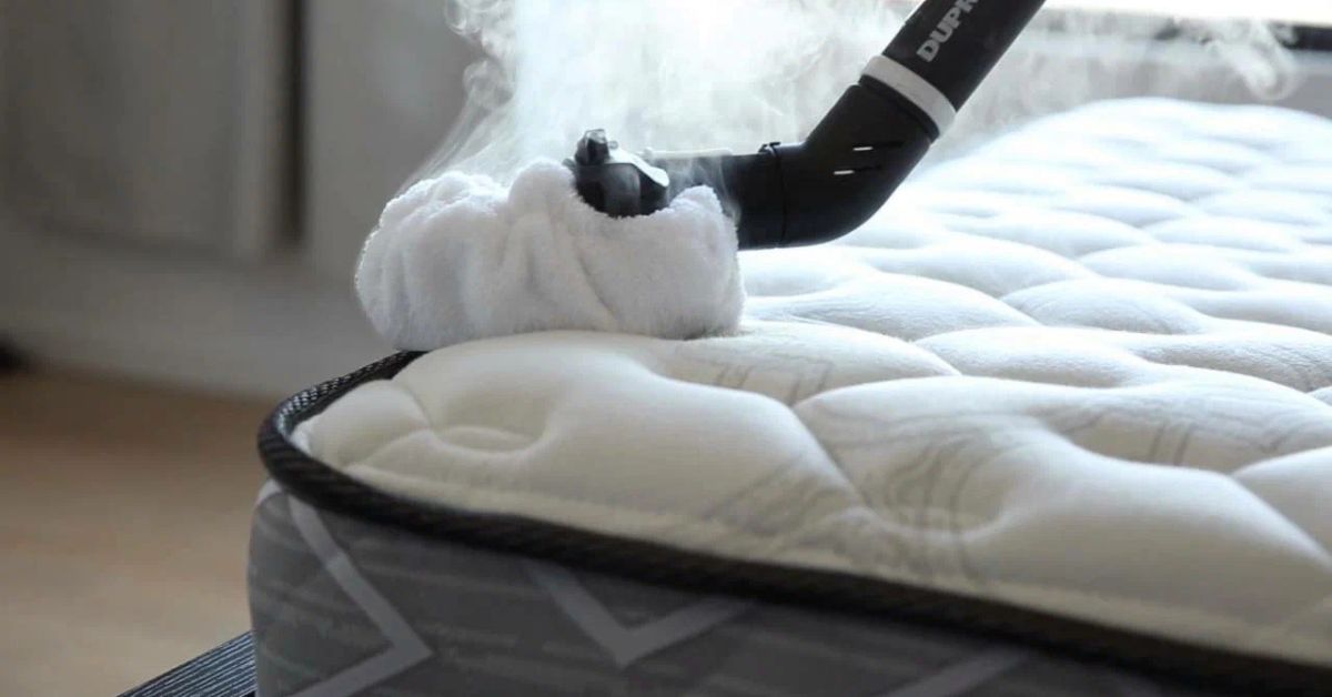 Clear water flowing over mossy rocks.