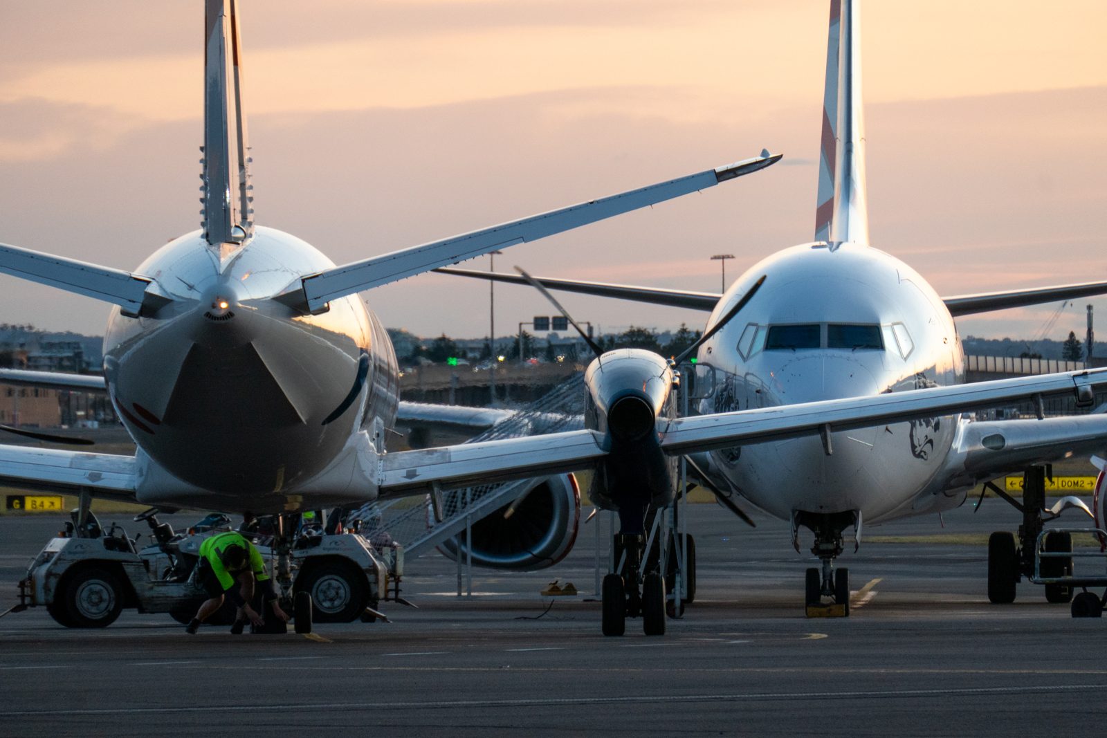Airliners parked on the apron at dusk