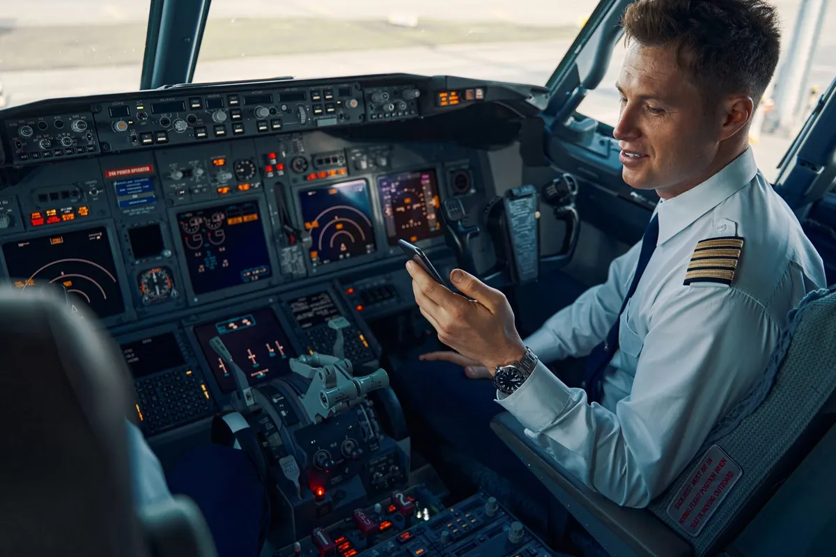 A pilot in the right-hand seat of a Boeing 737 flight deck