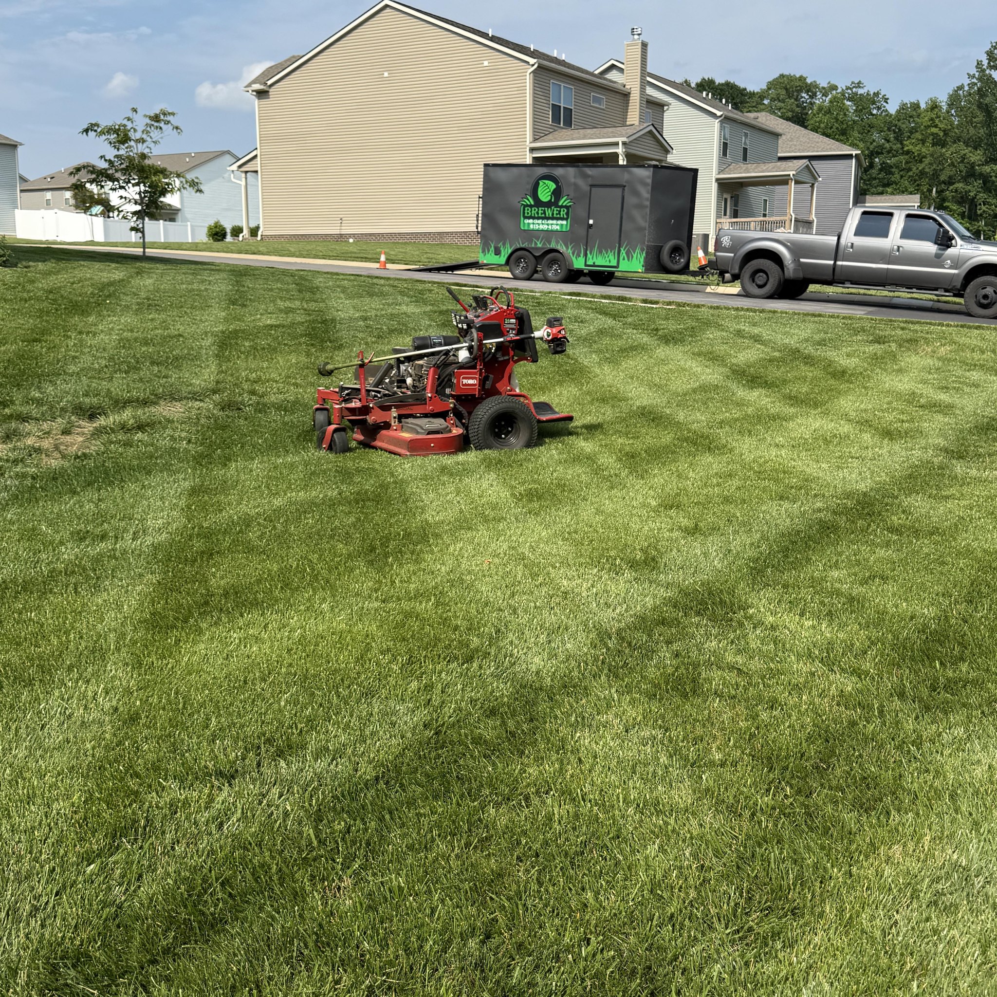 Brewer Lawn Care truck and equipment at Spring Hill TN property