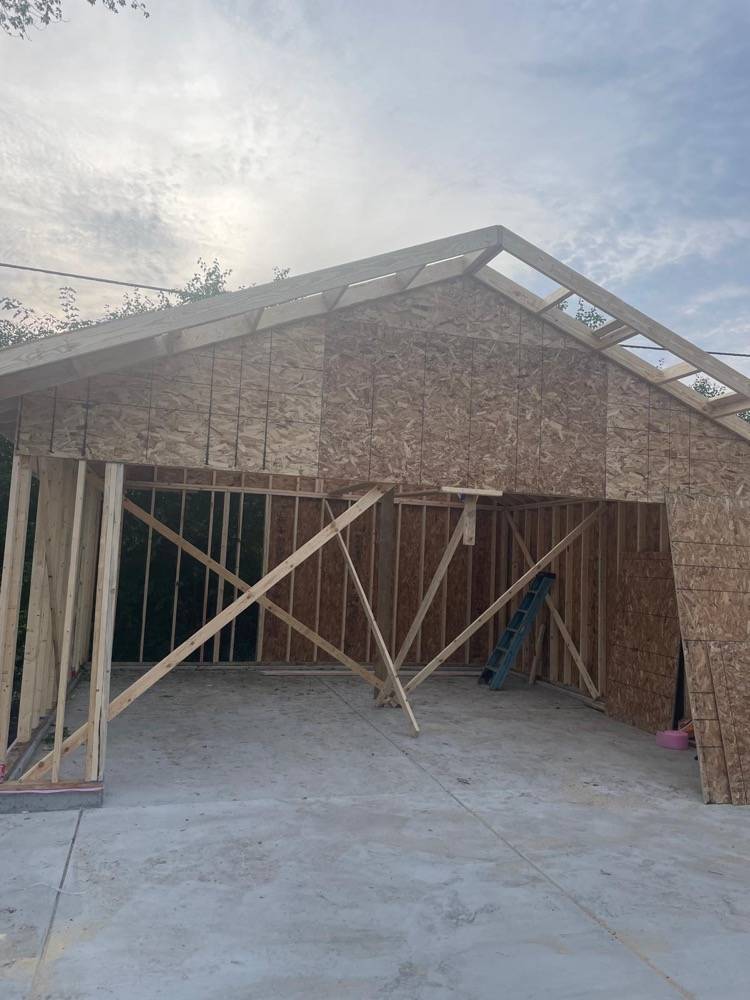 New home construction with OSB sheathing and gable roof framing