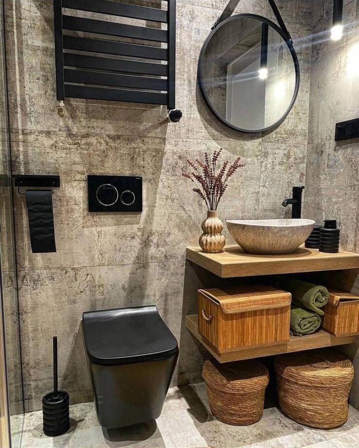 Industrial-style bathroom with concrete-effect walls, black fixtures and vessel sink on wood shelf