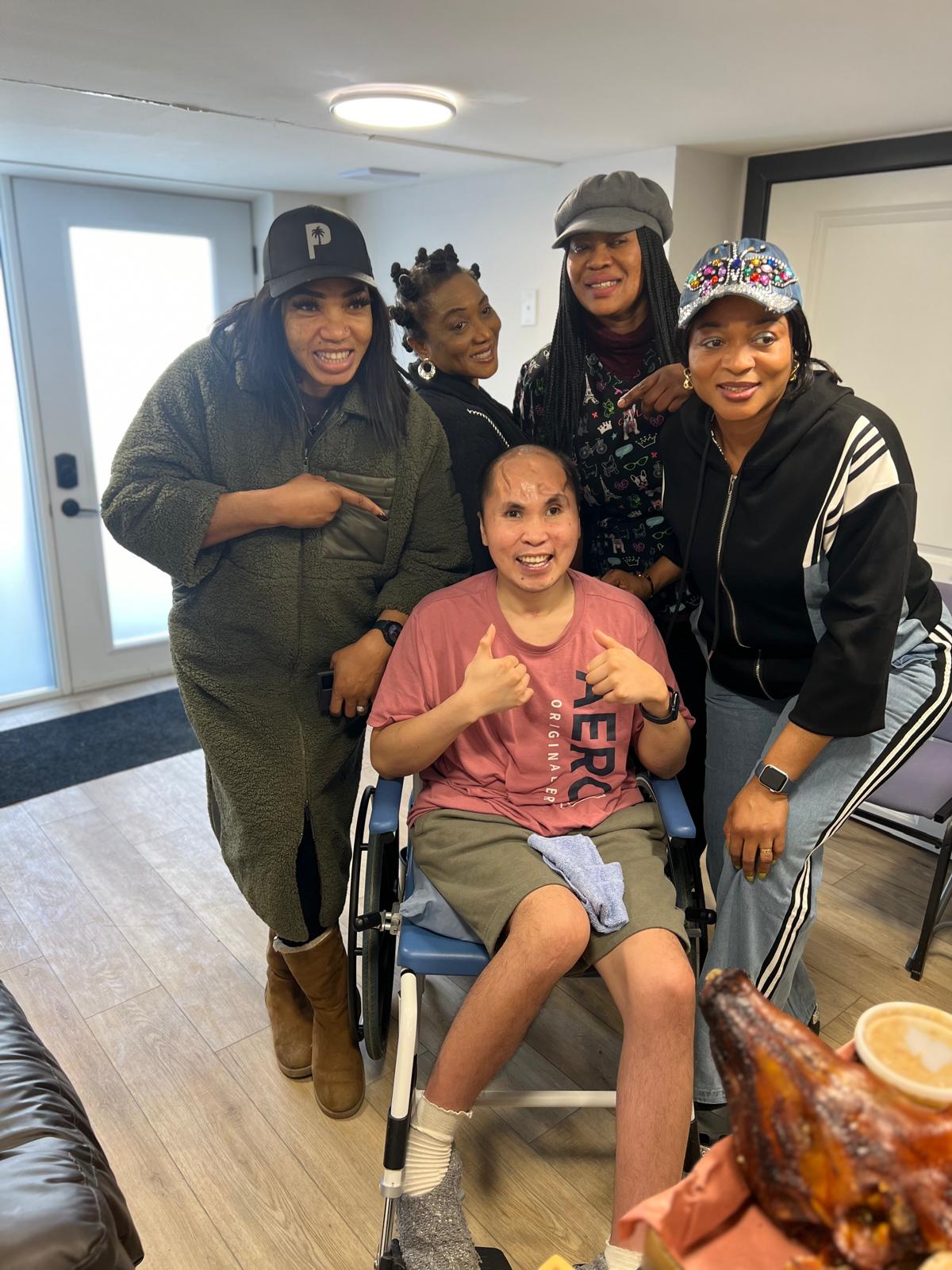 Supportive staff assisting residents in daily activities in a bright, home-like Ontario setting.