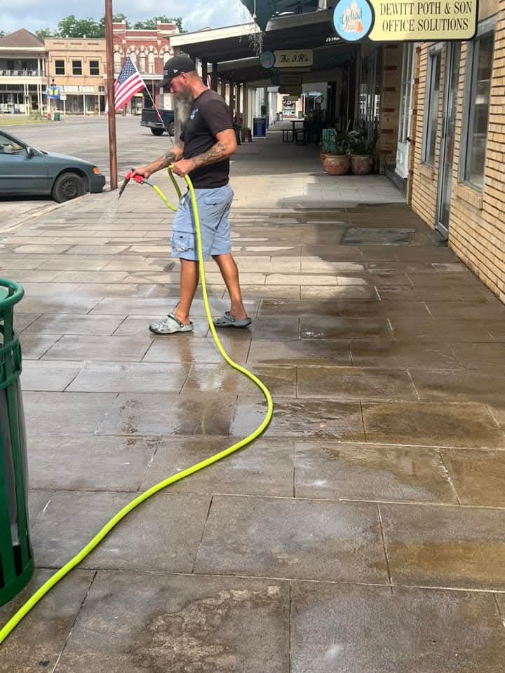 Randy Maddux washing commercial side walk