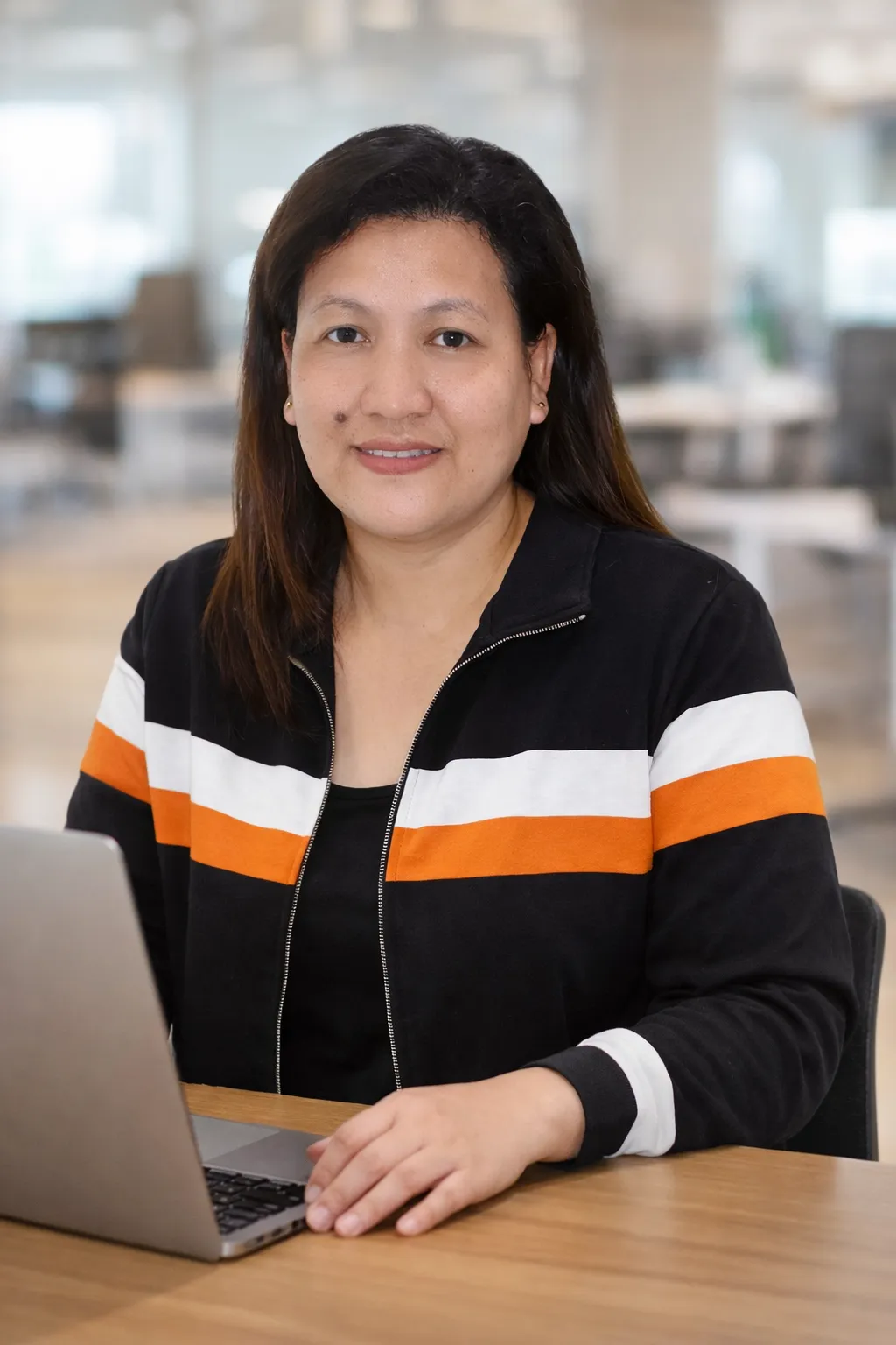 Construction virtual assistant workspace with plans and laptop