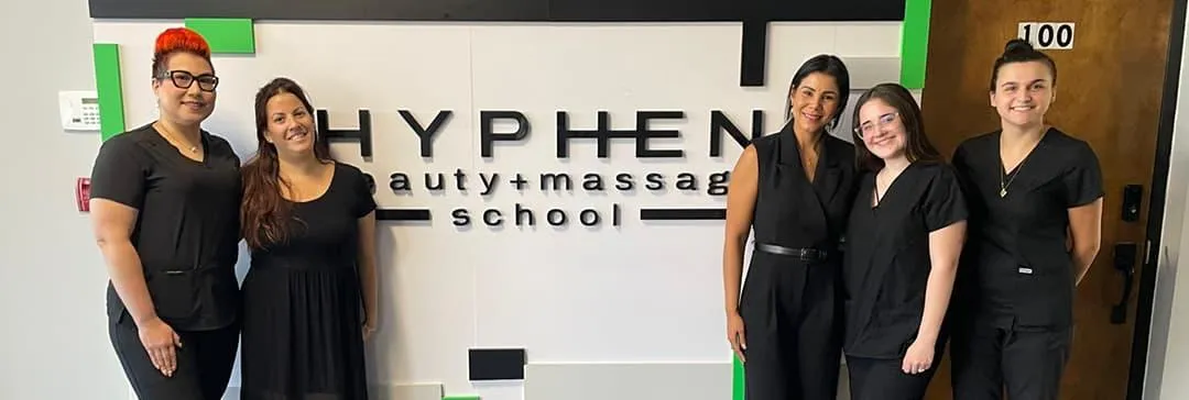 Student performing facial treatment during skin care program in Winter Park at Hyphen Beauty School