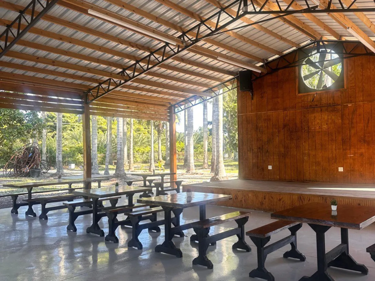 a man sitting at a table in front of a cake