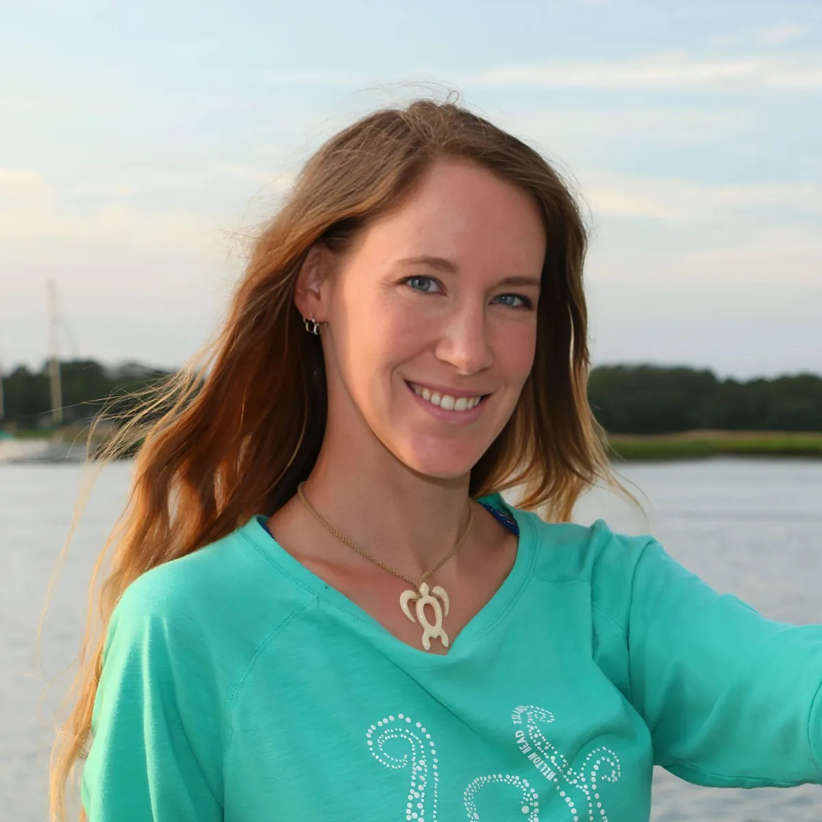Nina an animal behaviorist with ocean in background 
