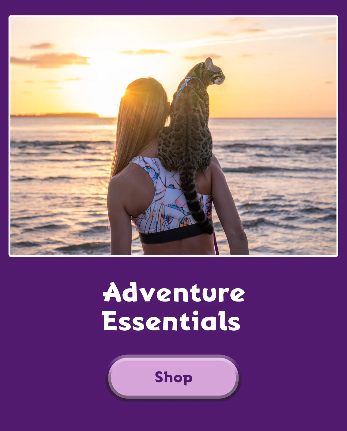 girl with cat on her back at the beach