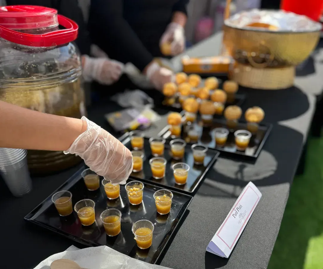 A man sitting in front of a table filled with food