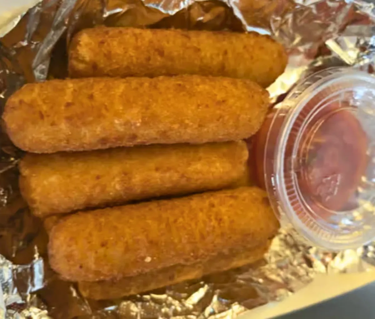 Mozzarella sticks from Nate’s Plates in Midland TX – golden fried cheese sticks served with marinara sauce.