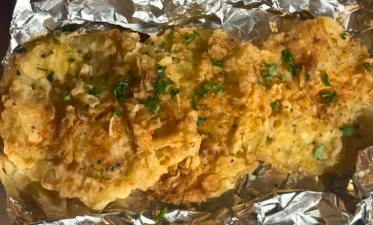 Fried green tomatoes from Nate’s Plates in Midland TX – crispy golden tomatoes garnished with herbs.