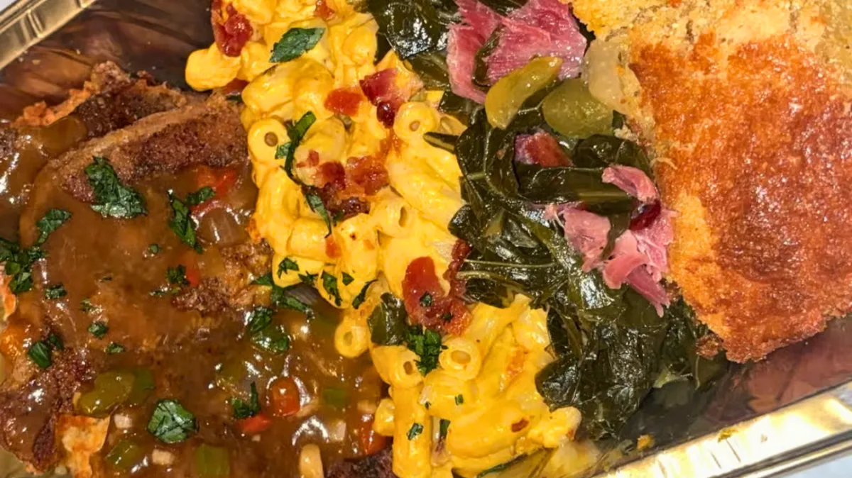 Porkchop plate with mac and cheese, collard greens, and cornbread from Nate’s Plates in Midland Texas.