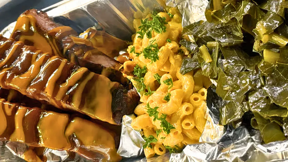 Rib plate with barbecue-glazed pork ribs, macaroni and cheese, and collard greens from Nate’s Plates in Midland Texas.