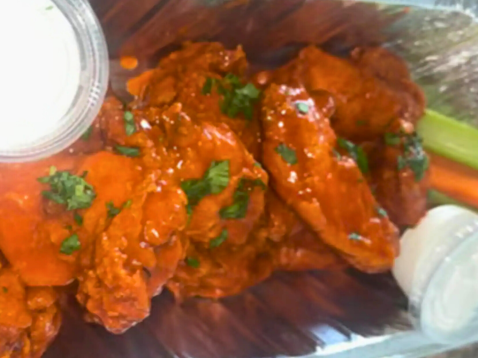 Buffalo chicken wings with ranch, celery, and carrots from Nate’s Plates in Midland Texas.