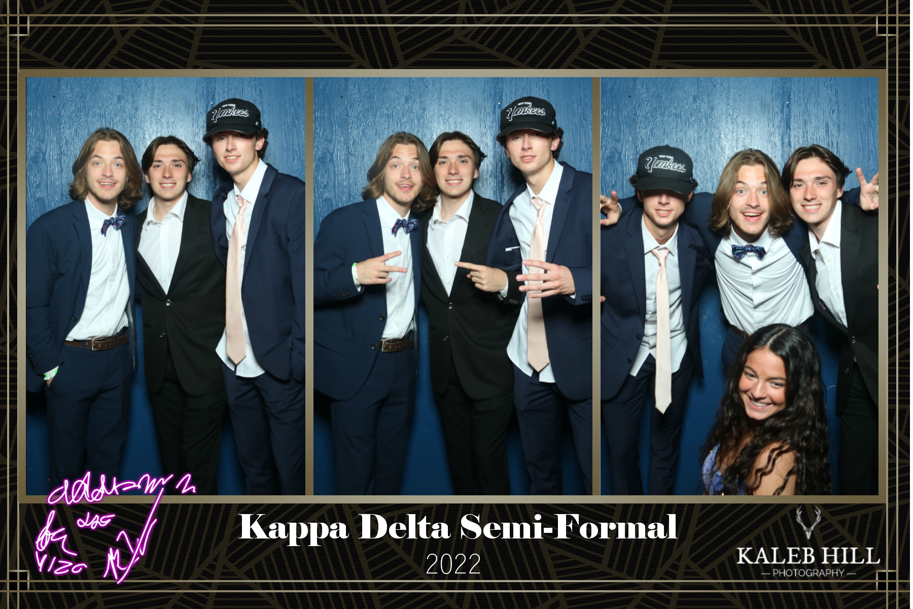 Corporate semi-formal event group portrait with branded photo booth backdrop.