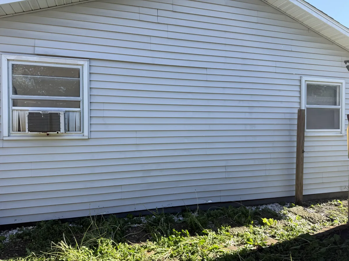 After photo showing the starting condition for Siding Cleaning in Clinton, IL