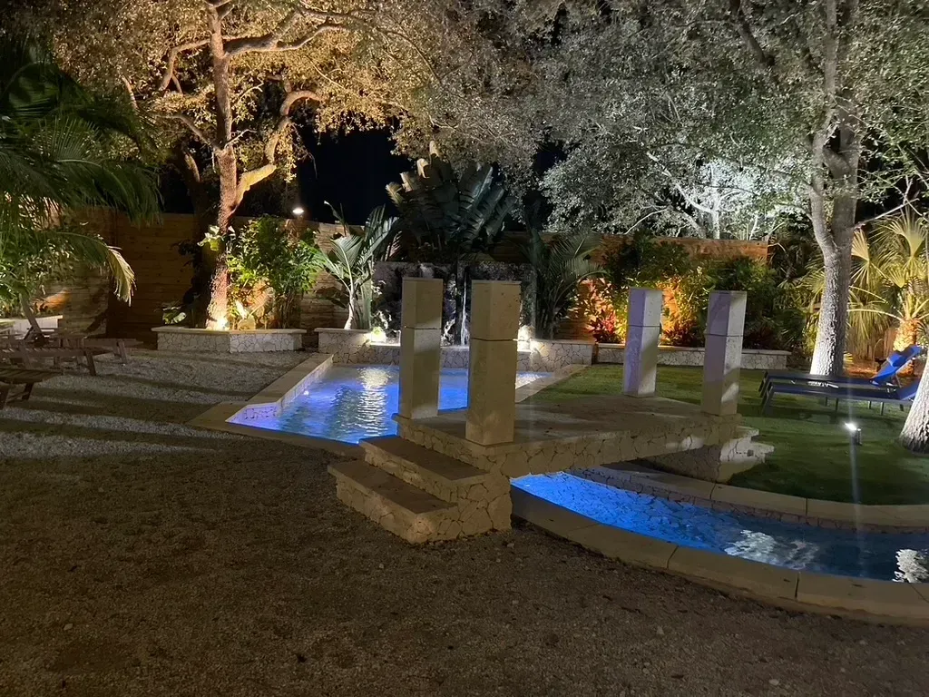 Blessings Miami night Peaceful coral stone waterfall and lagoon for beautiful natural weddings & events in Miami Florida.