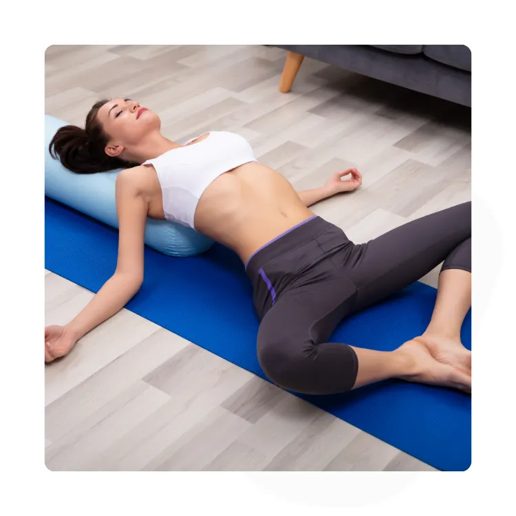 person in supported supine butterfly yoga pose