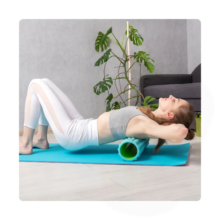 person using a massage roller on their back
