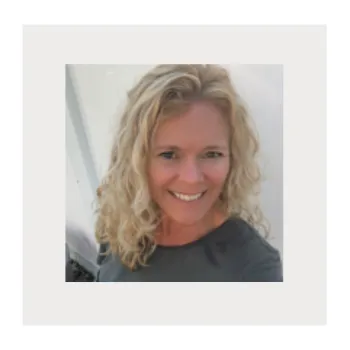 Yoga instructor, Jennifer with True to You Yoga, smiling, encouraging you in your yoga practice