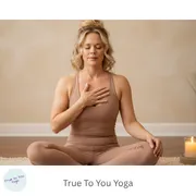 women sitted with hand on heart