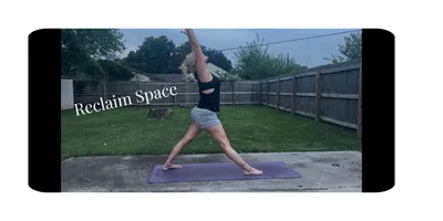 woman standing in a yoga star pose