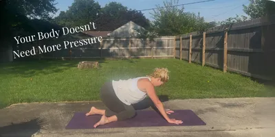 woman in modified cow face yoga pose
