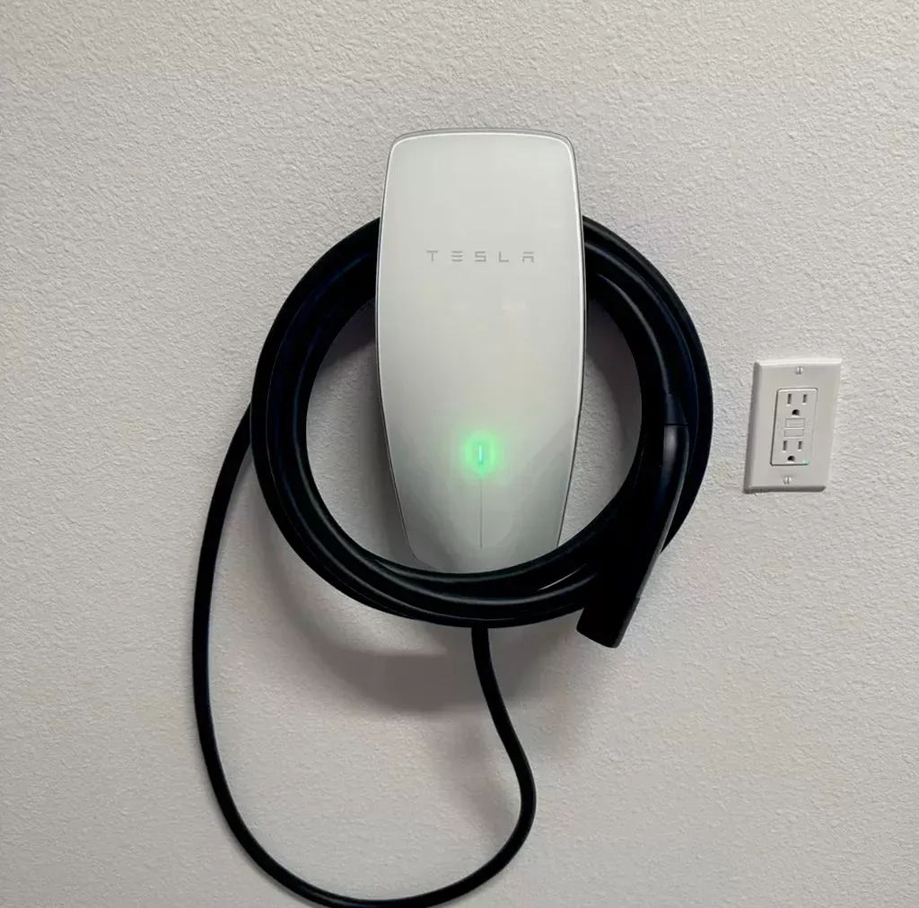 a white Tesla charger, installed by IRK Electrical Services