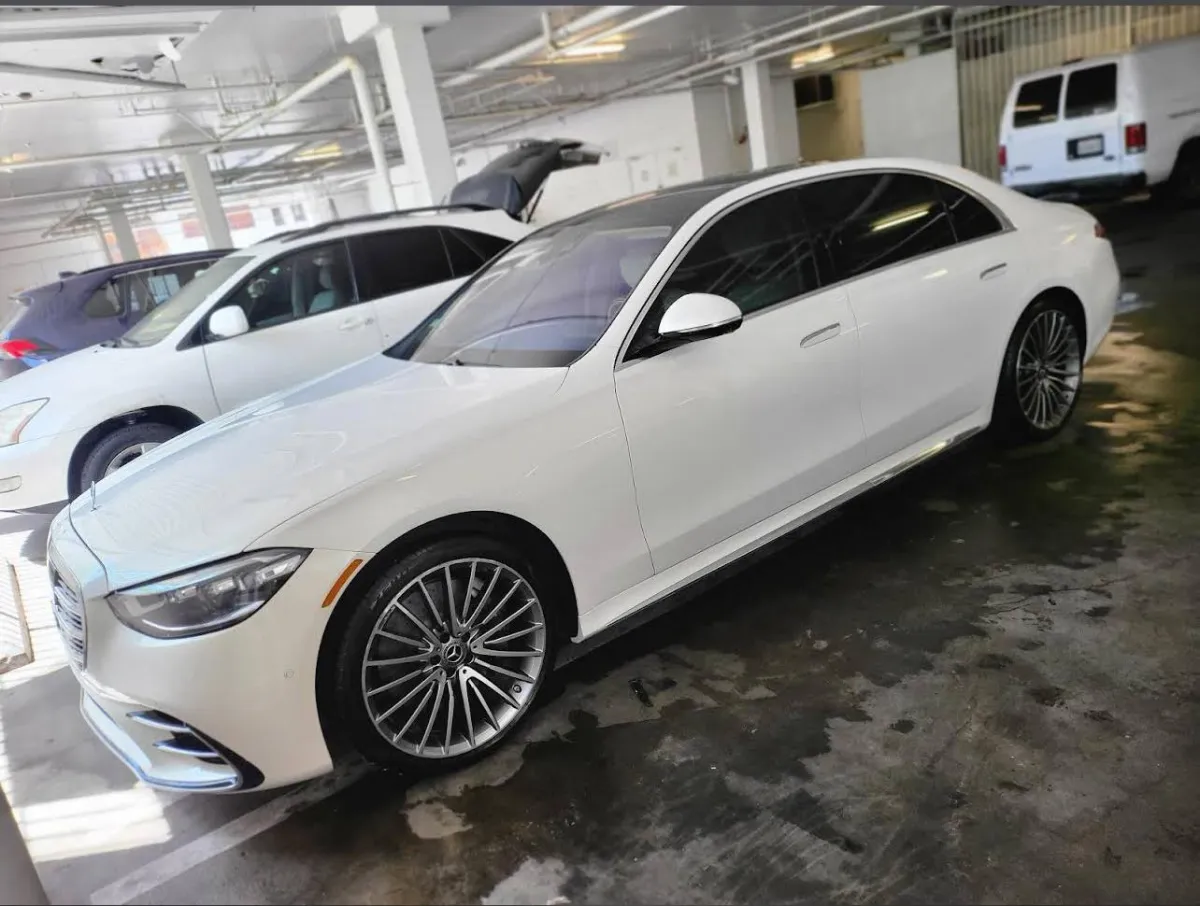 White Mercedes-Benz S-Class in a parking garage after receiving full exterior and interior mobile detailing in Los Angeles