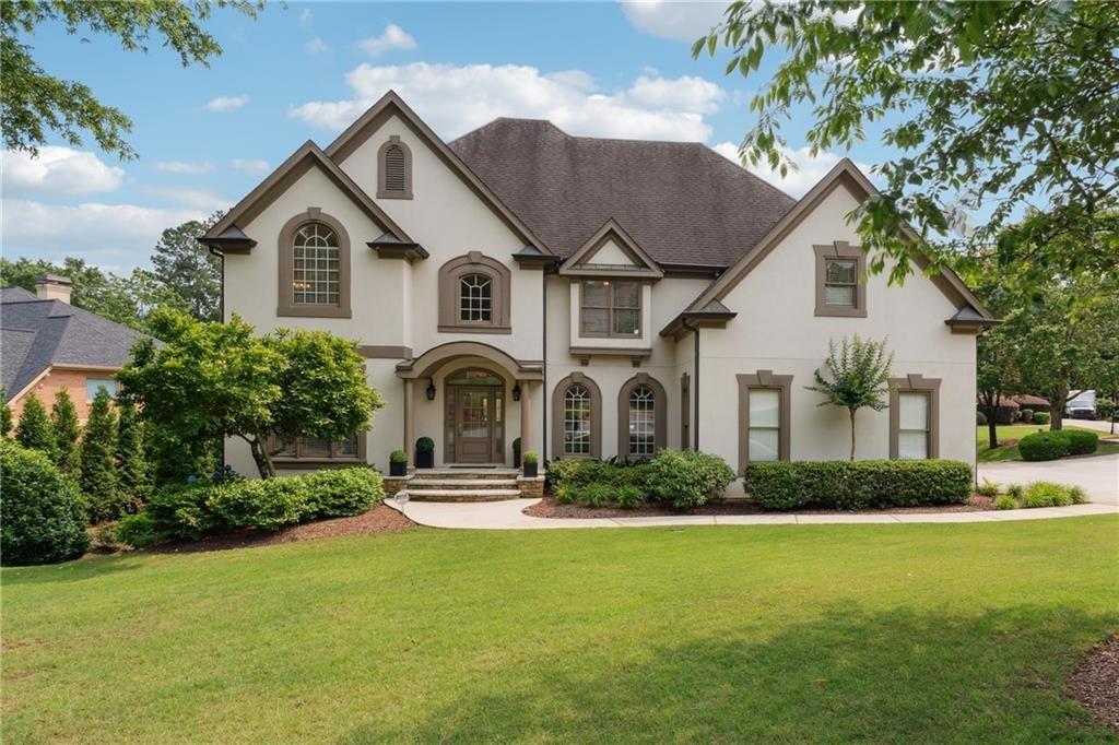 Stucco home for sale in Johns Creek in The Falls of Autry Mill